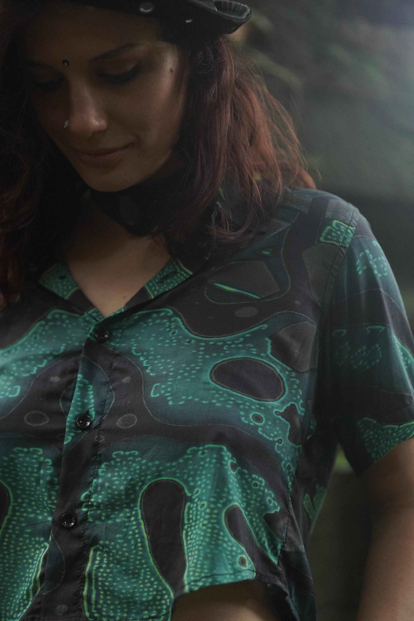 Bamboo cropped shirt for women close-up of psychedelic green print fabric