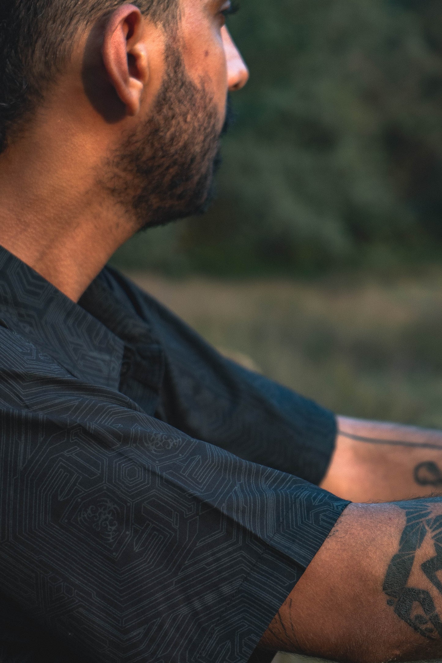 close up black viscose shirt geometric cybernetic pattern