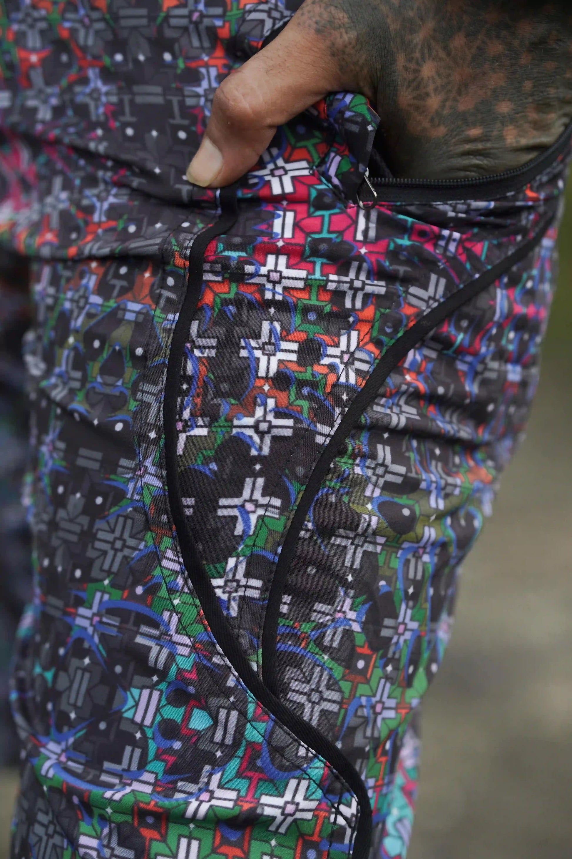 psychedelic geometric swim shorts close-up pattern