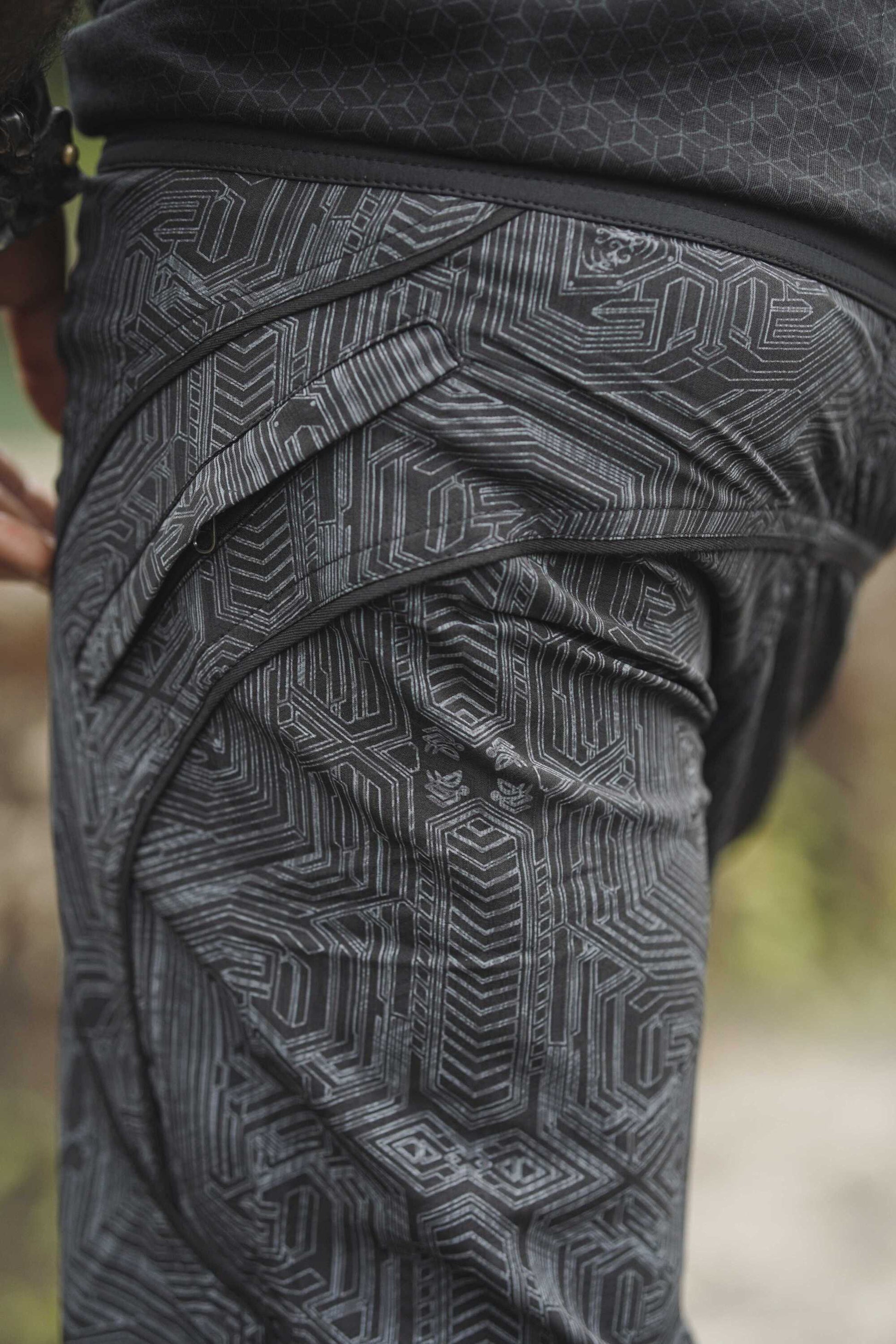 black geometric cyberpunk swim shorts back pocket detail festival shorts design